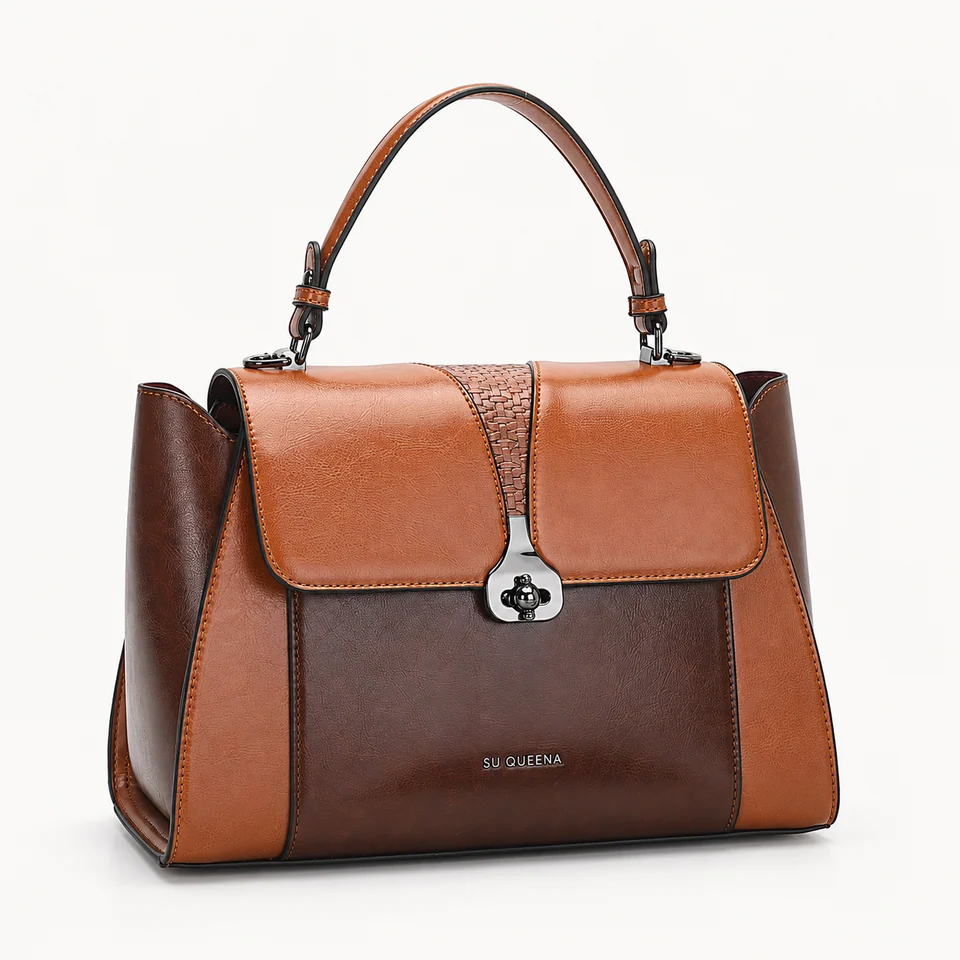 SU QUEENA 2784 large brown and cognac bag with dark turn-lock, isolated on off-white.