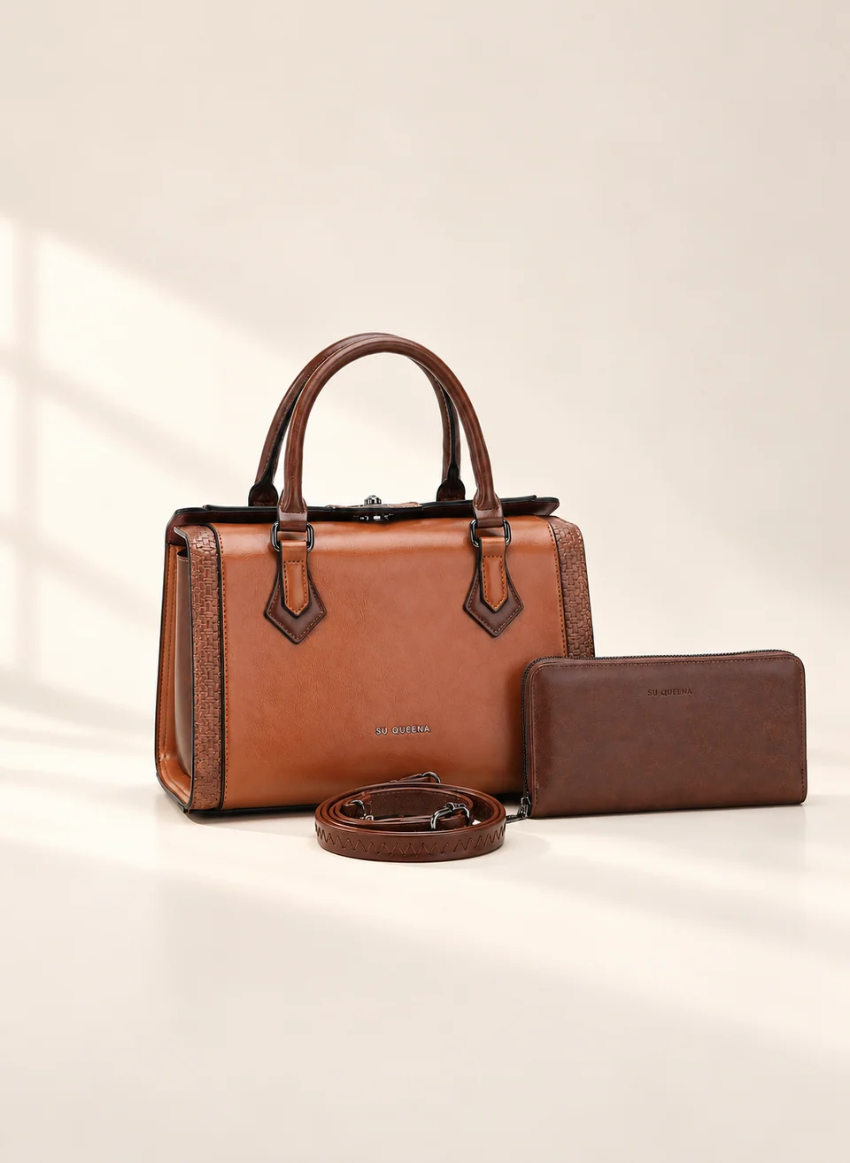 Model 2813, front three-quarter view with twin handles, shown with a wallet and coiled shoulder strap.