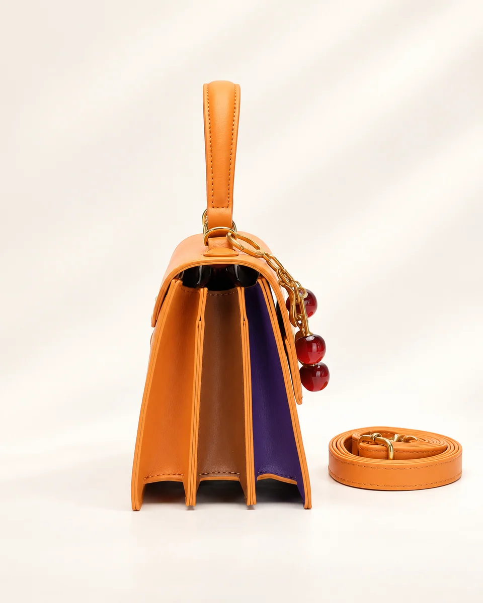 SU QUEENA 3244 orange bag side gussets with cherry charm and strap