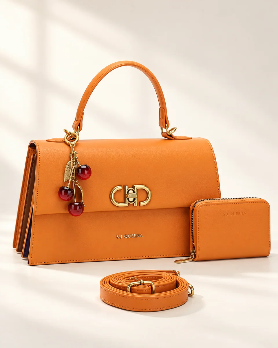 Model 3244, front three-quarter view with an arched handle, hanging charm, wallet and shoulder strap.